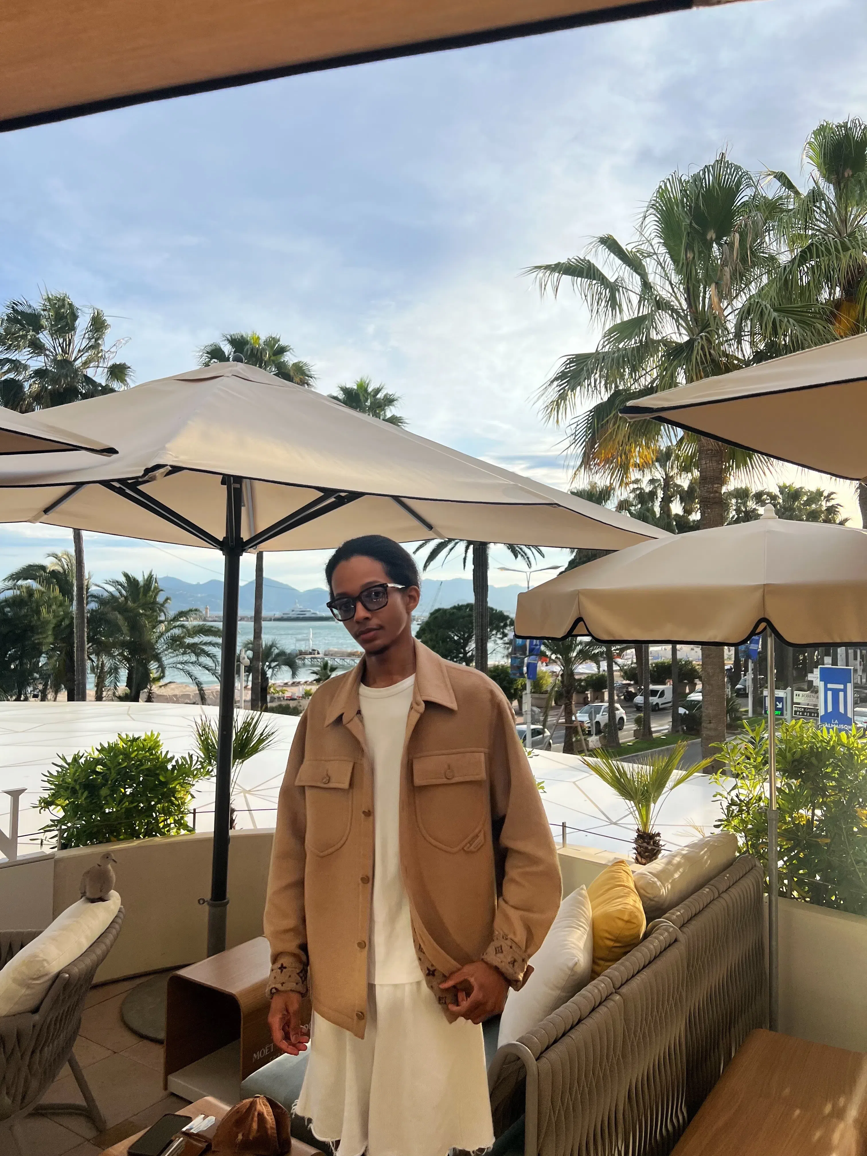 In my favorite Louis Vuitton overshirt and all white everything else